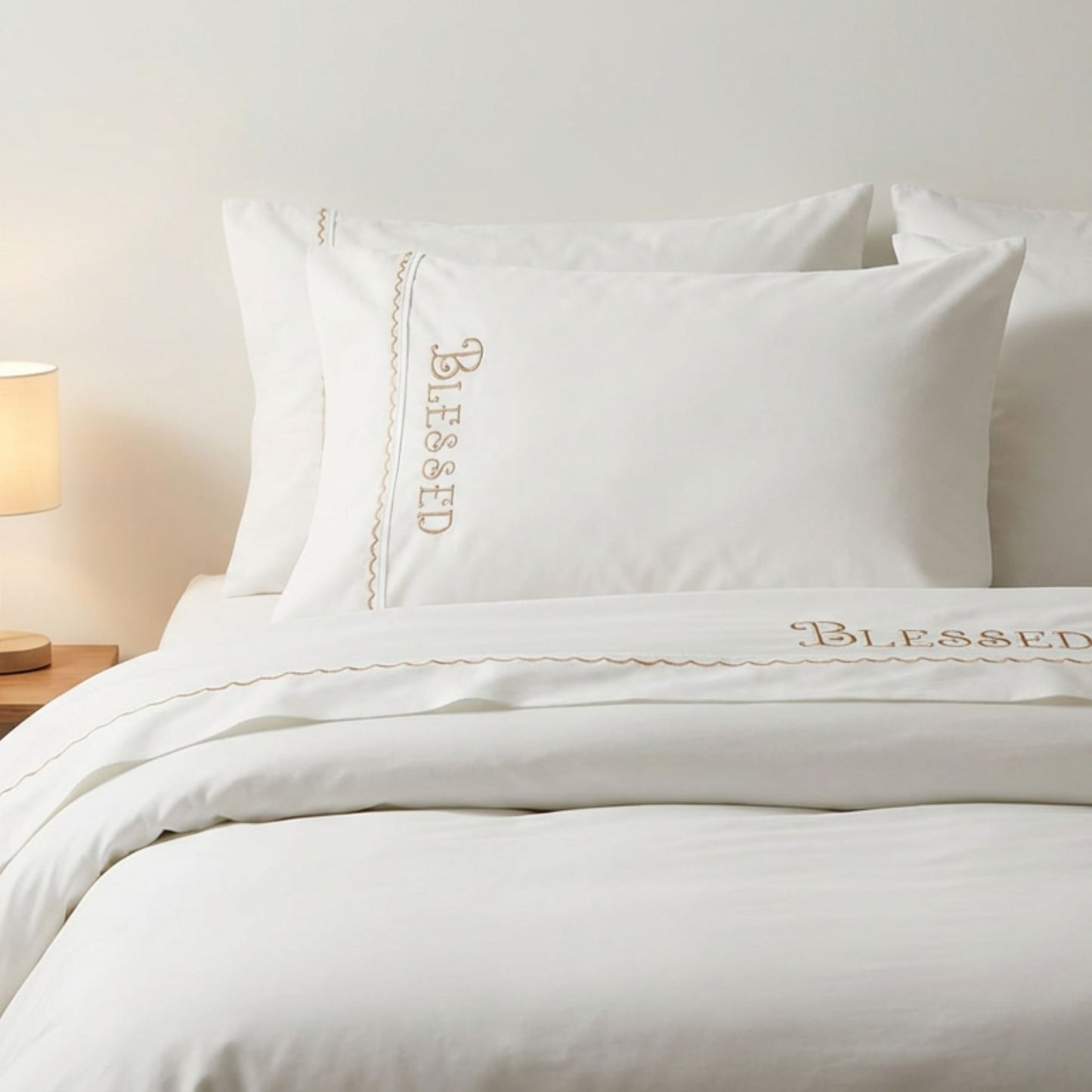 Blessed embroidered bed sheets in 600 thread count 100% cotton. White luxury bedding with scallop trim and custom color embroidery.