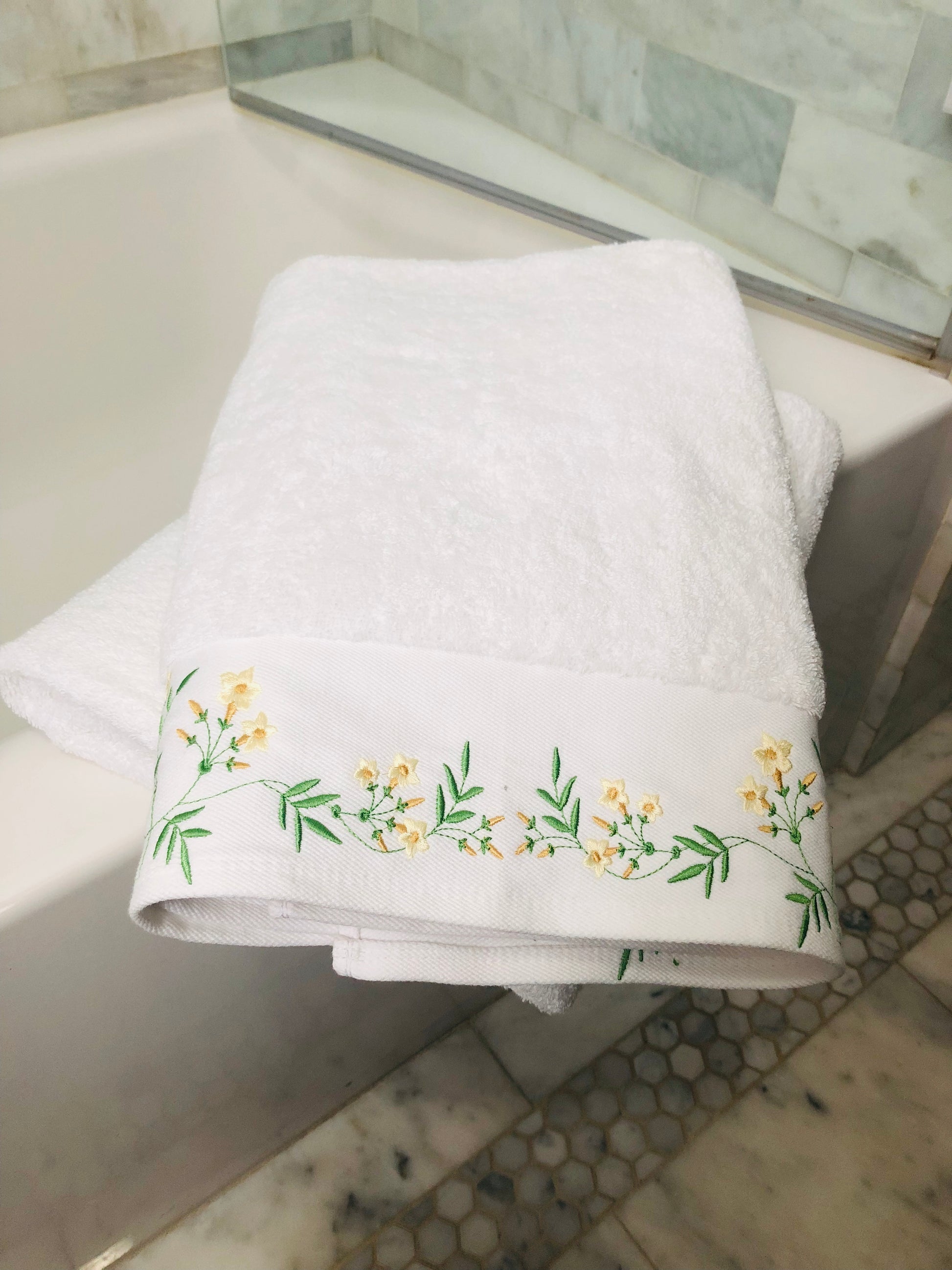 bath towel embroidered with flowers