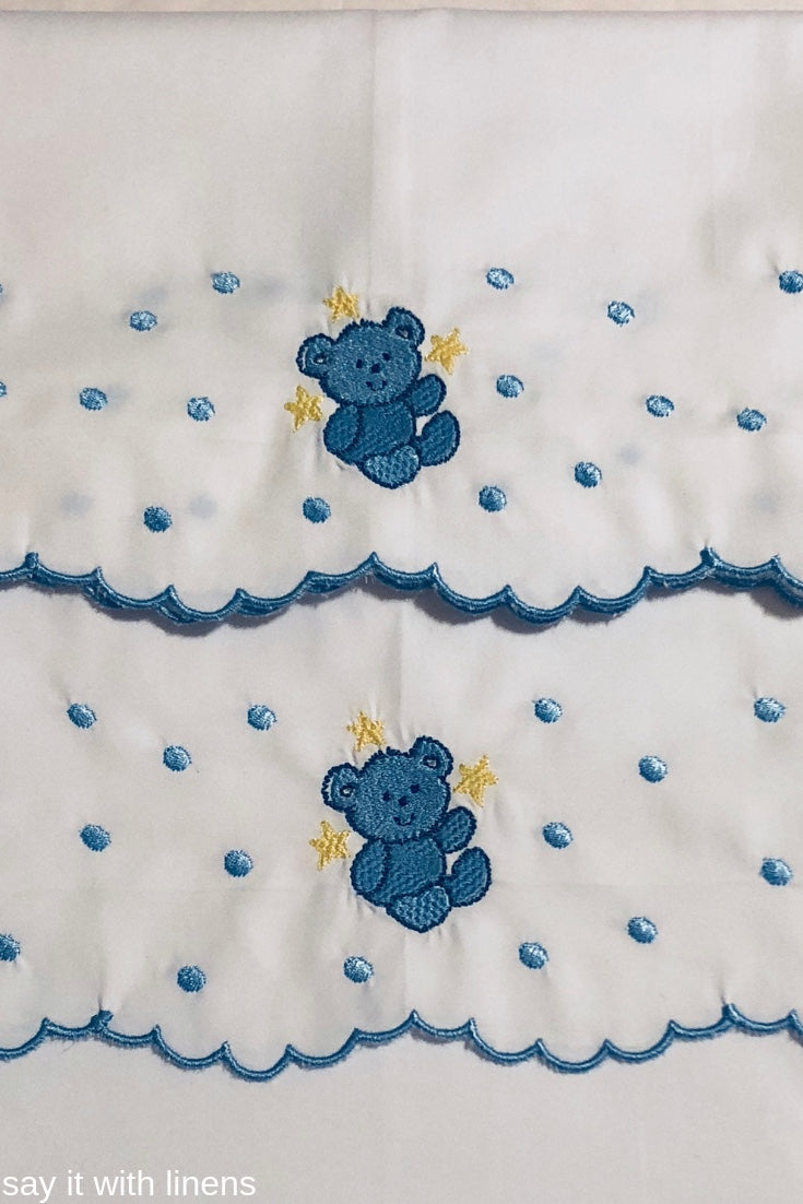 crib sheets embroidered with a bear design