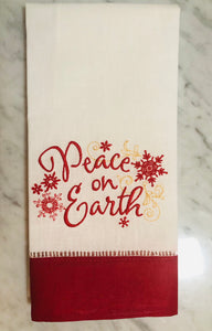 linen Christmas guest towel embroidered with red peace on earth design 