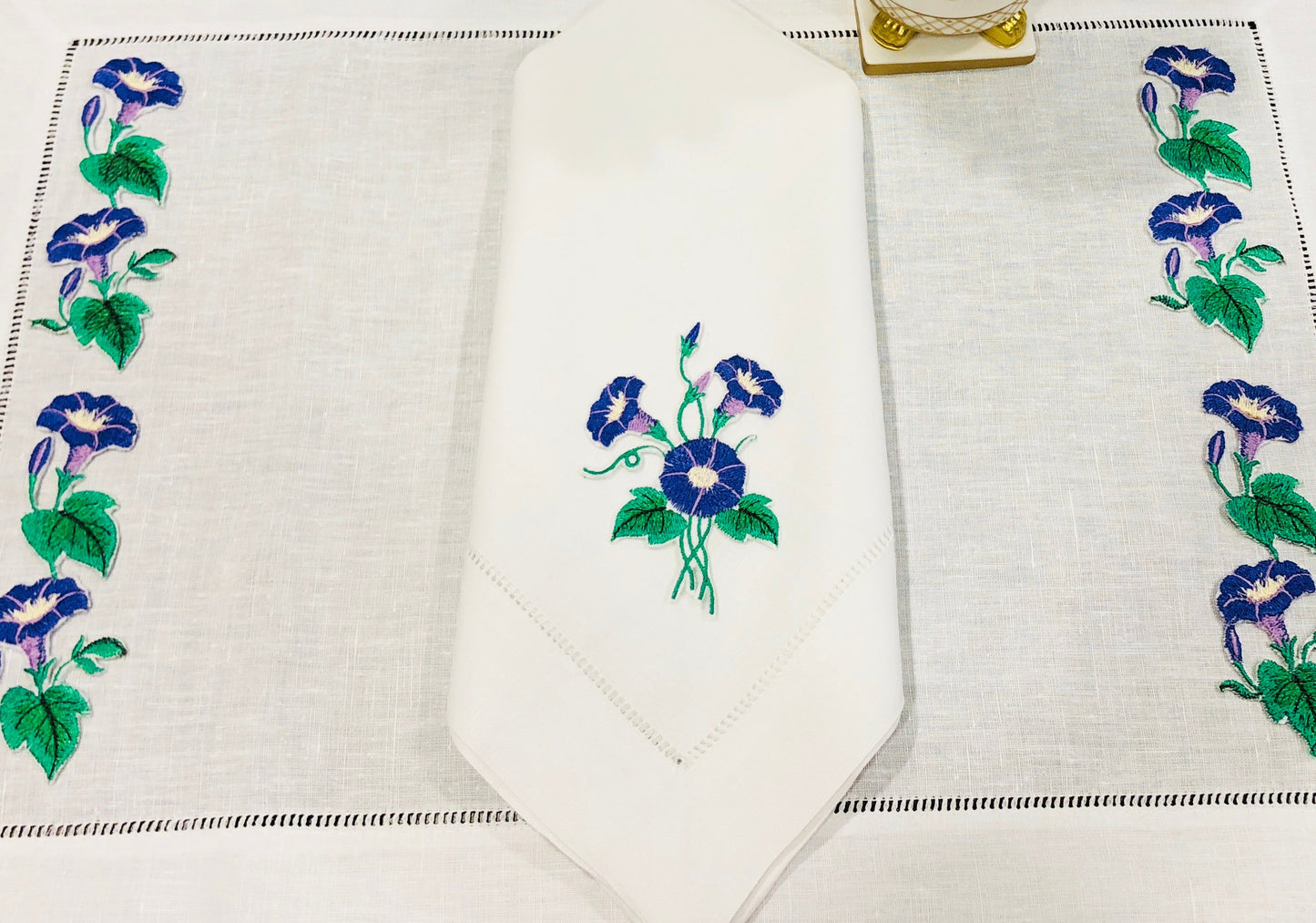 linen placemat and linen dinner napkins embroidered with purple morning glory flowers 