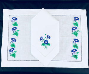 matching placemat and dinner napkins embroidered with morning glory flower desing
