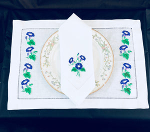 linen placemat and linen dinner napkins embroidered with purple morning glory flower design