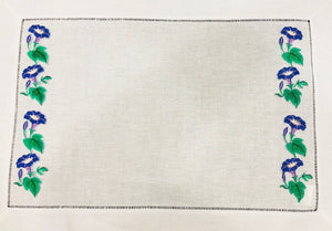 linen placemat embroidered with morning glory flowers